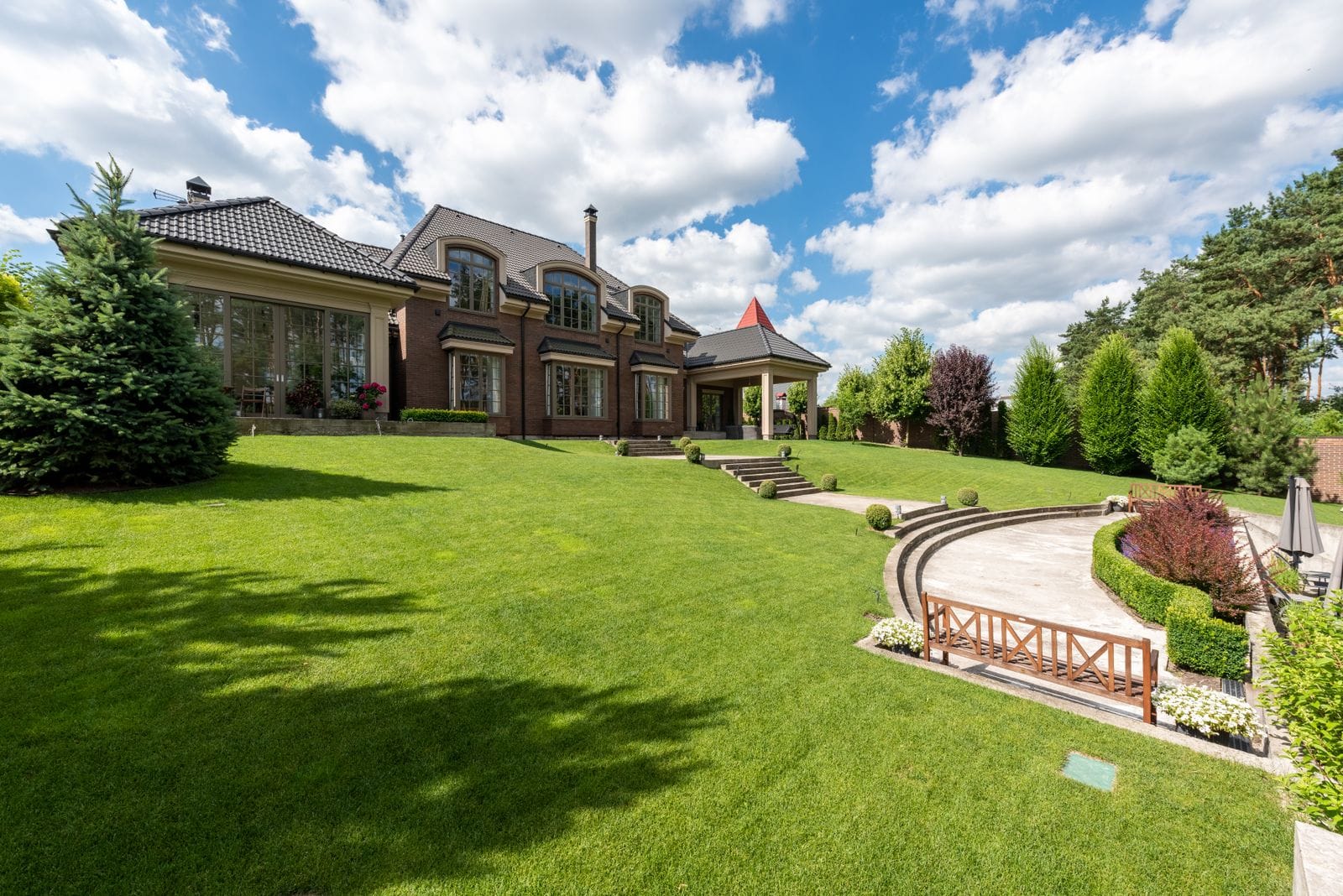 Handsome brick home with a manicured lawn in Metro Detroit